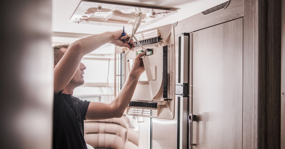young man fixing wires