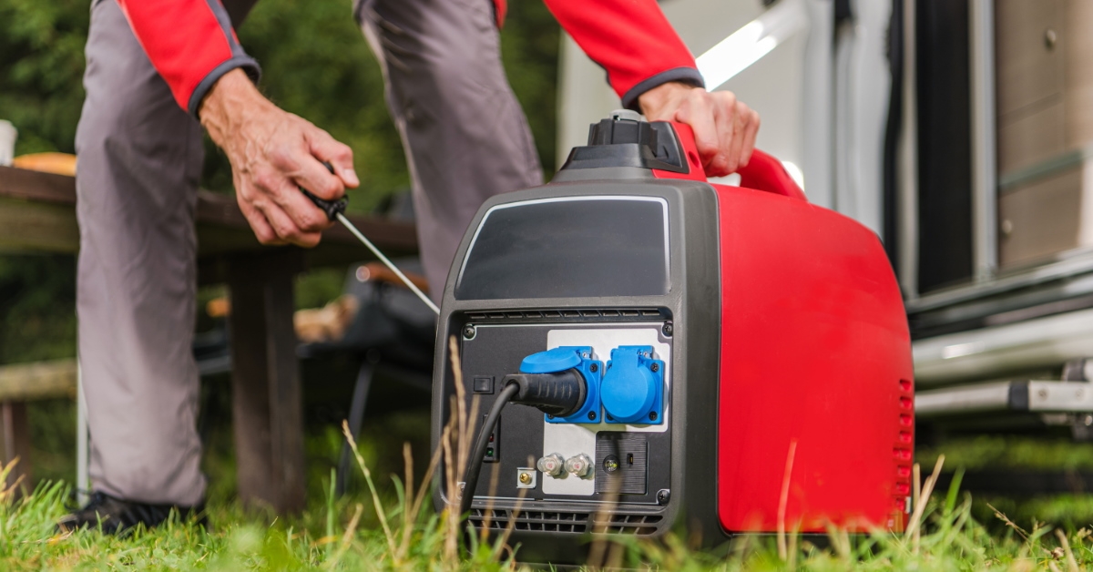 man starting a portable generator