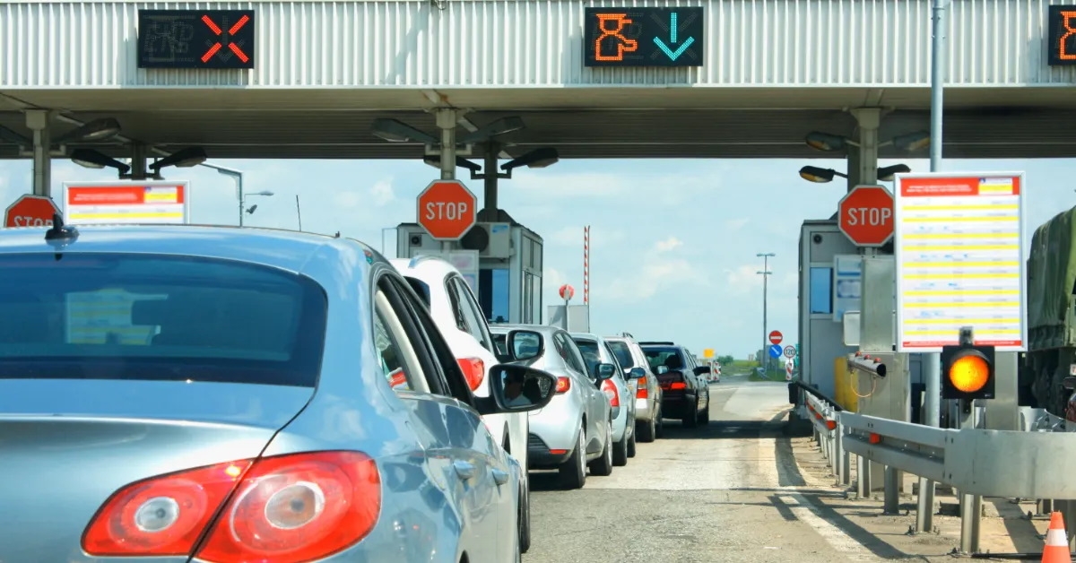 cars lined at toll booth