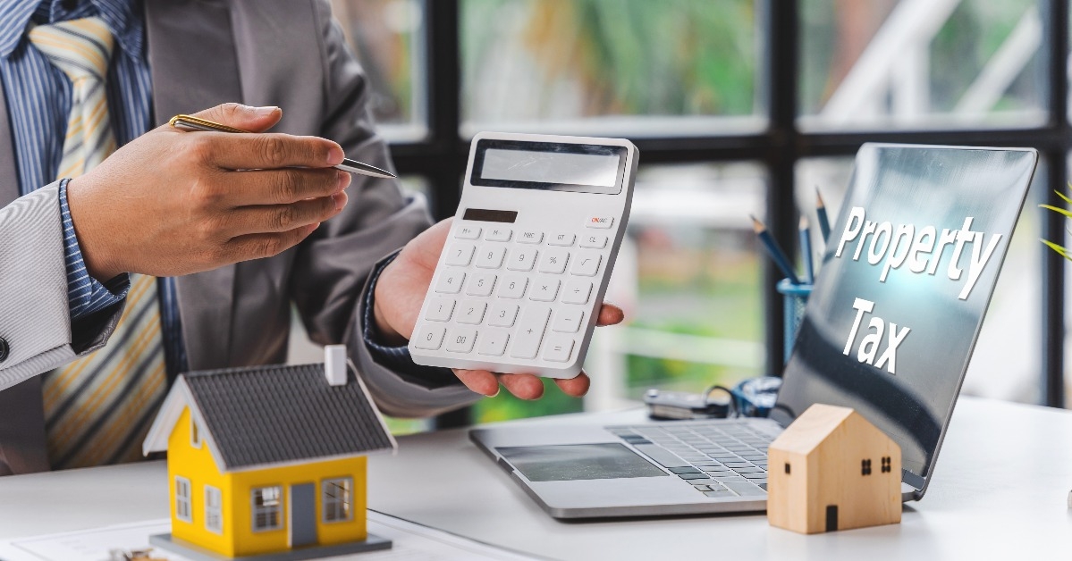businessman hands with house model
