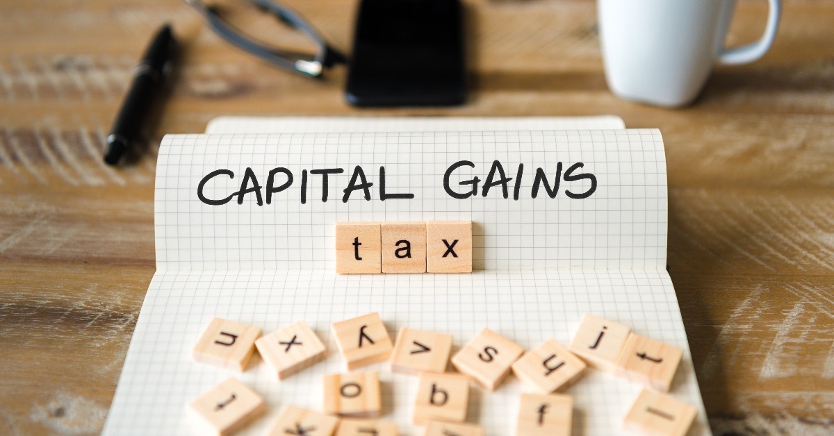  wooden blocks with letters making Capital Gains Tax text