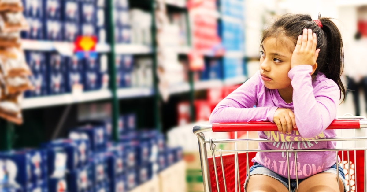 Bored girl in shopping cart