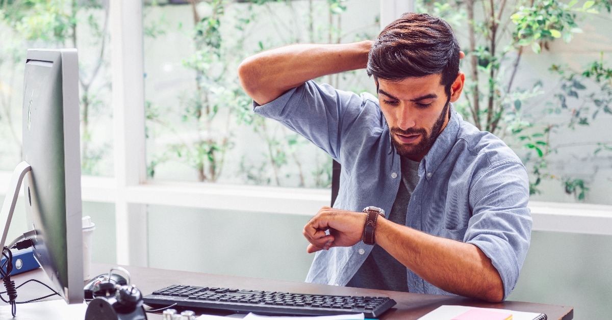 employee in urgency and deadline concept with alarm