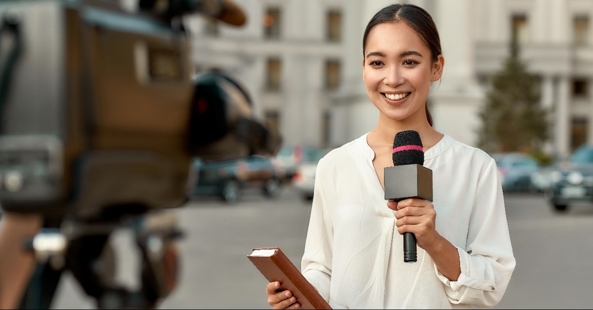 TV reporter presenting the news outdoors