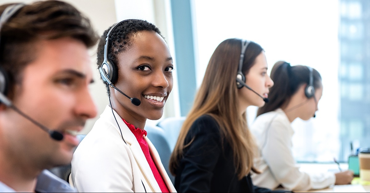 woman working in call center with diverse team