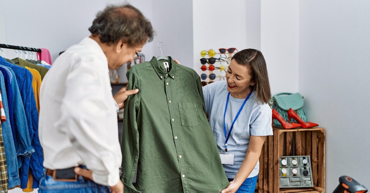 man choosing clothes at clothing store