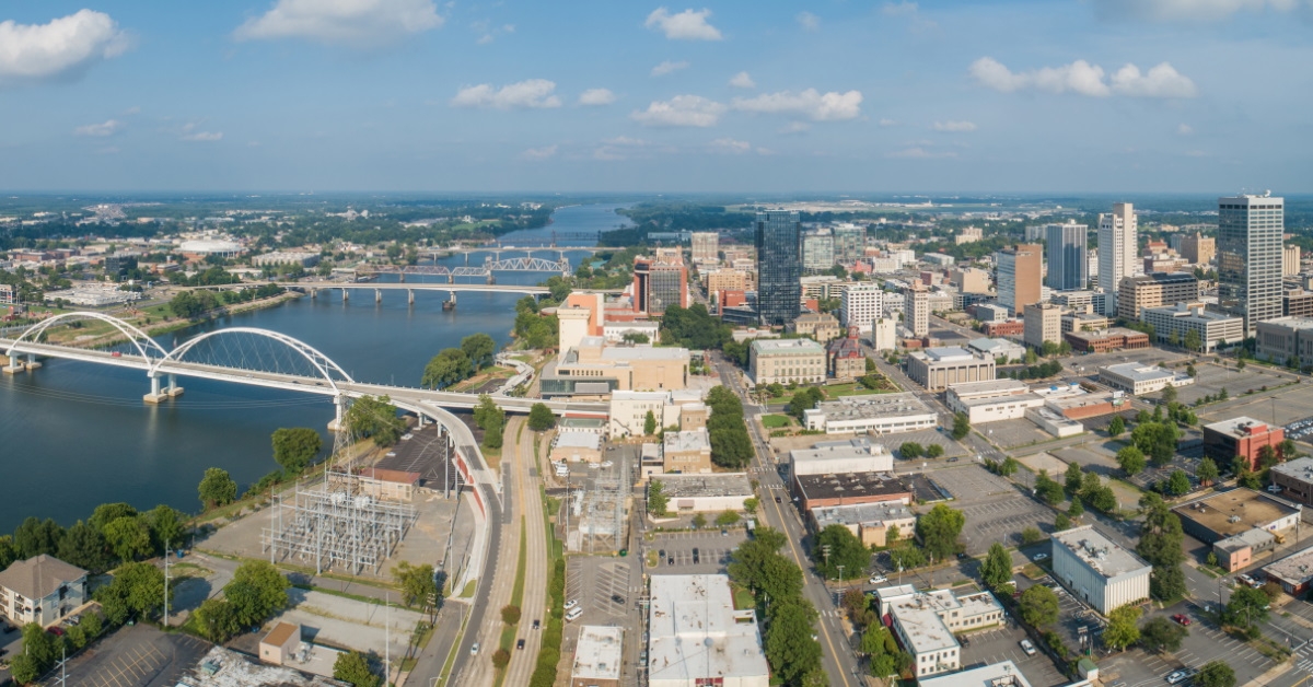aerial shot of buildings and bridges in the arkansas city