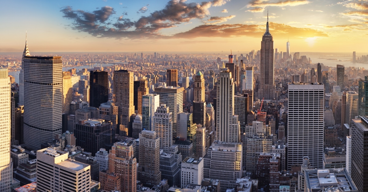 black clouds circling numerous skyscrapers in new york city during day time