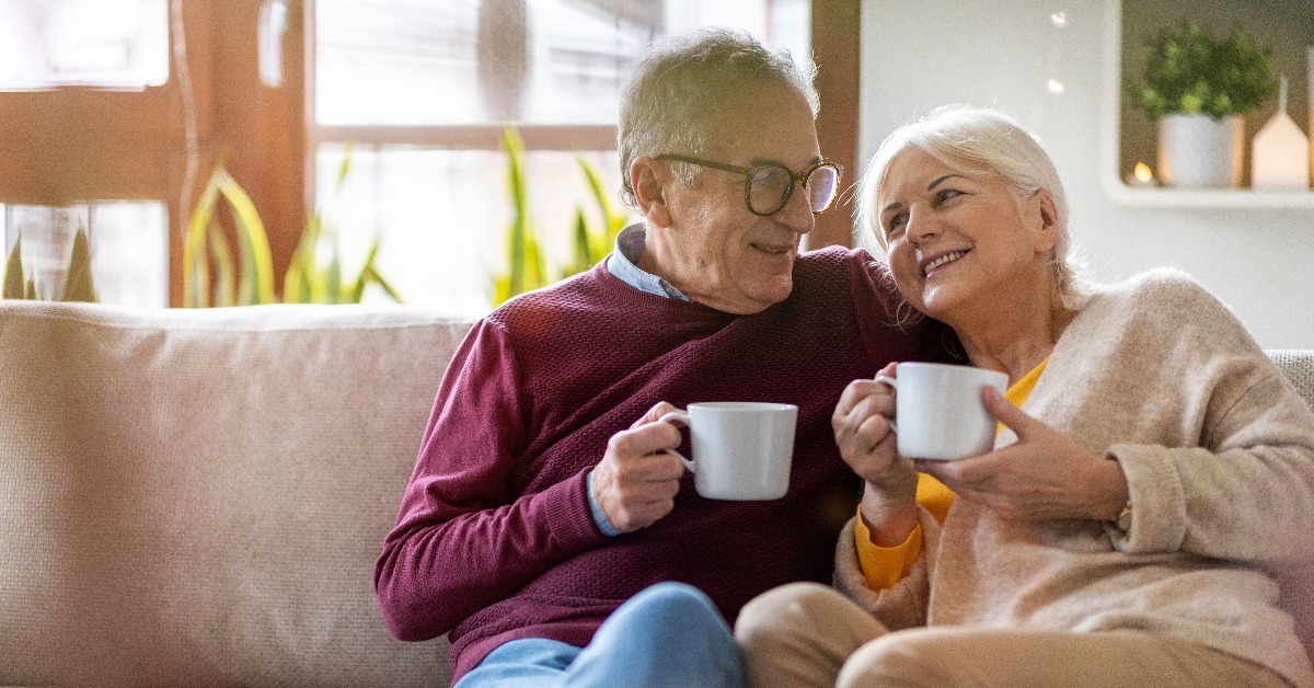  happy senior couple relaxing together at home