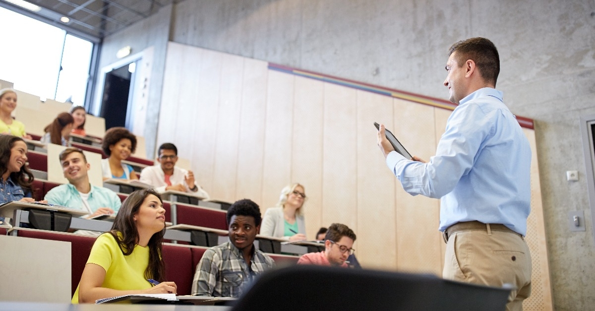 students and teacher with tablet pc at lecture