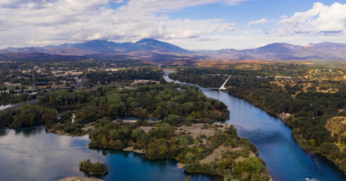aerial shot of sacramento river alongside green banks