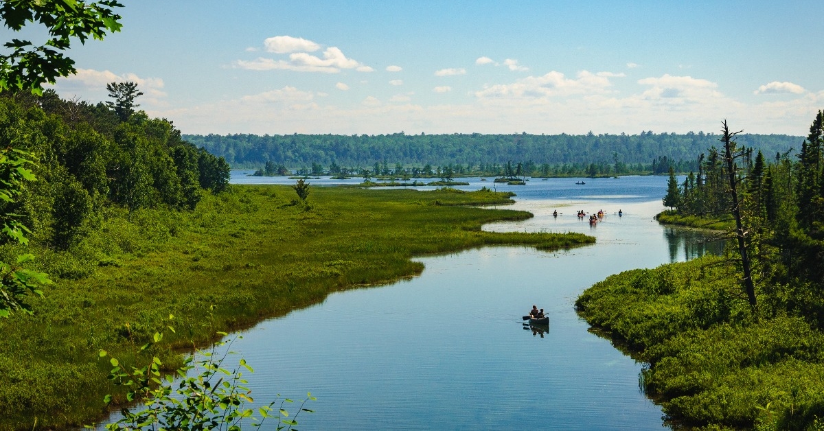 canoes and kayaks on northern river and lake on Madeline Island