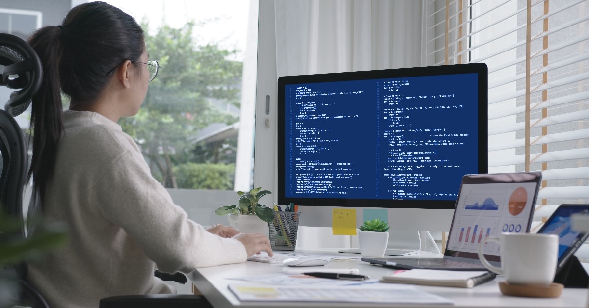 data scientist works remotely at home coding 