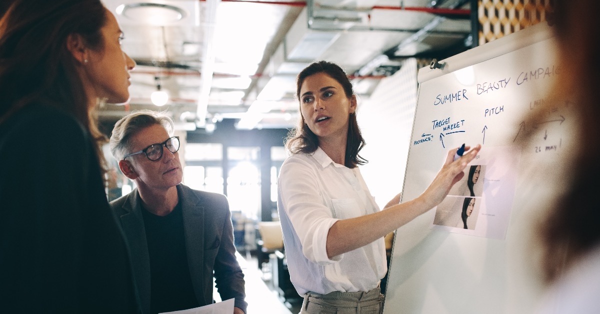 woman giving presentation over new advertising in office