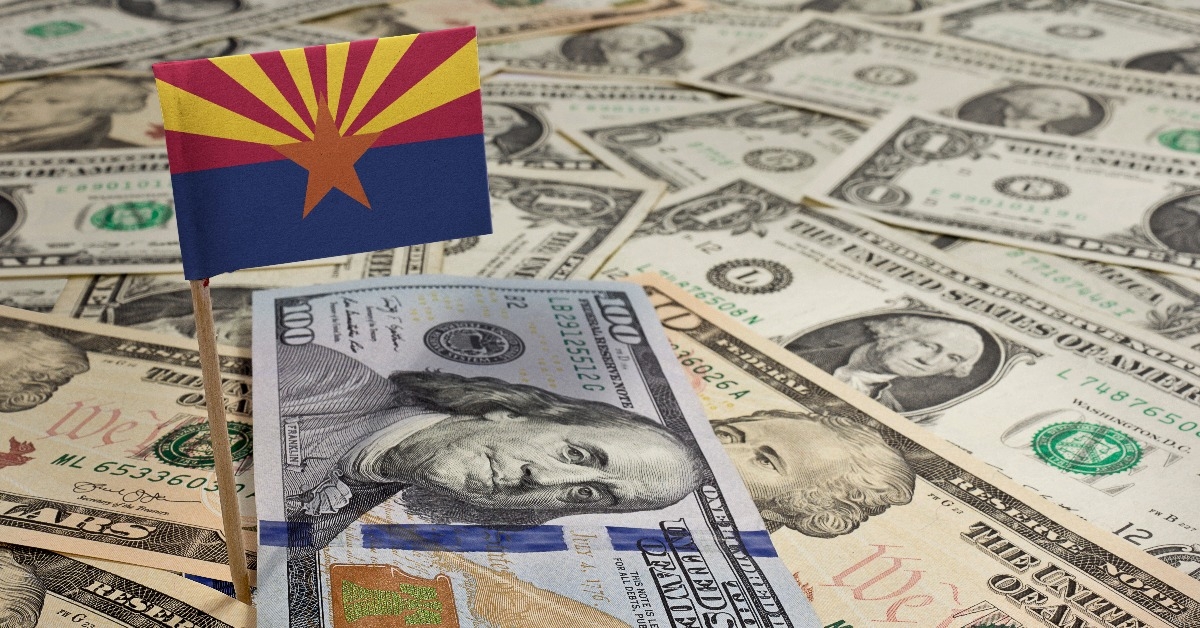 flag of Arizona sticking in various american banknotes