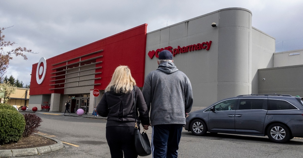 man and woman walking into a Target store