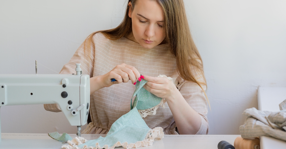 woman seamstress working at fashion atelier