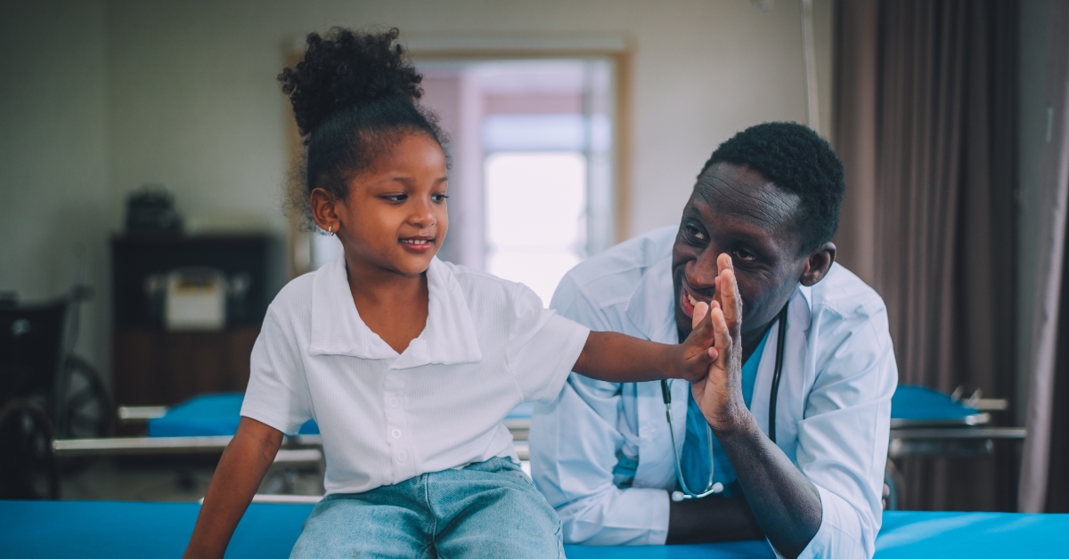 pediatrician with kid patient in hospital