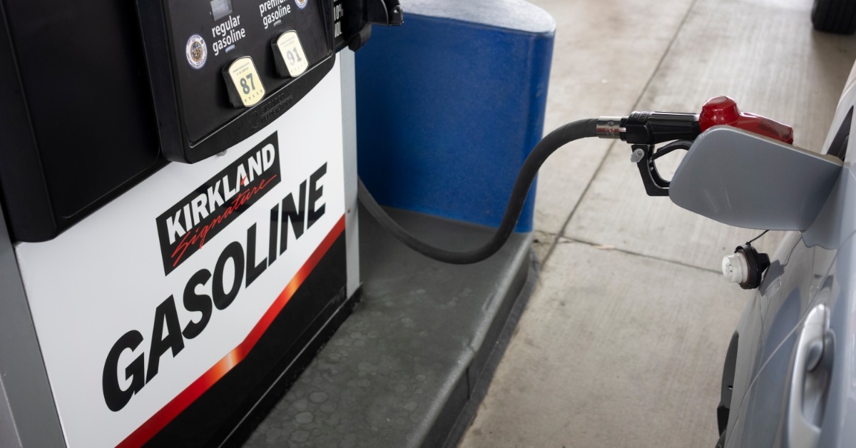 refilling gasoline in car at gas station
