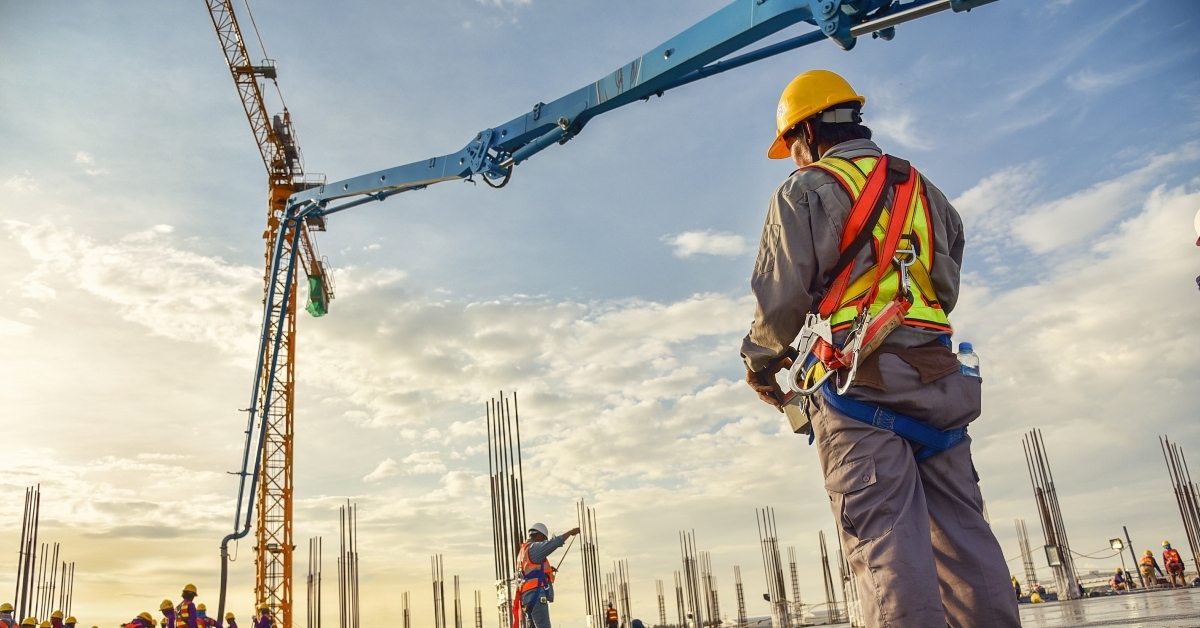 Construction worker pouring concrete