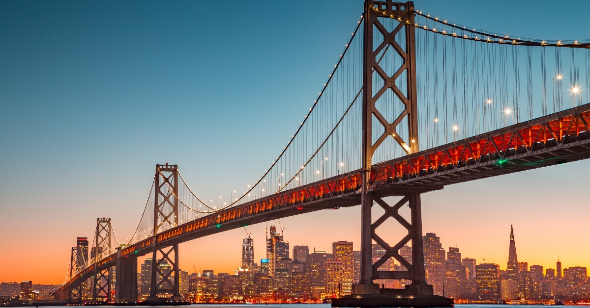 San Francisco skyline with Oakland Bay Bridge at sunset