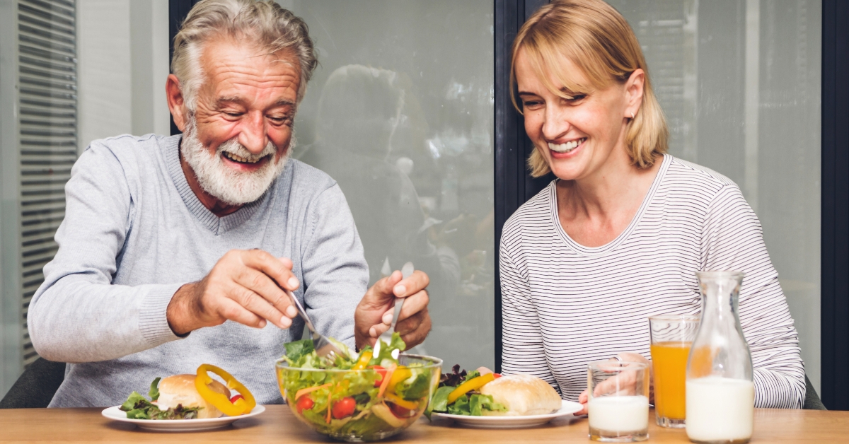 senior couple enjoy eating healthy breakfast together