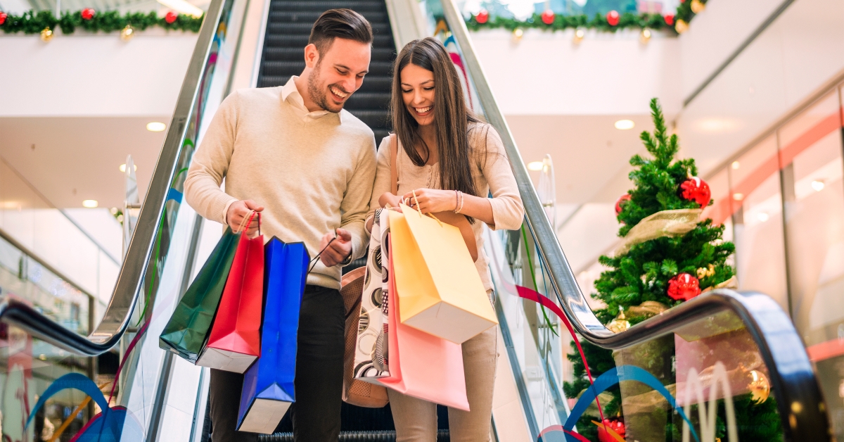 loving couple doing Christmas shopping together