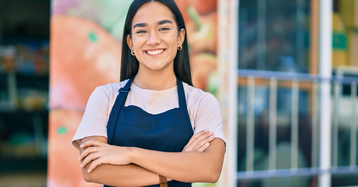 girl with arms crossed smiling