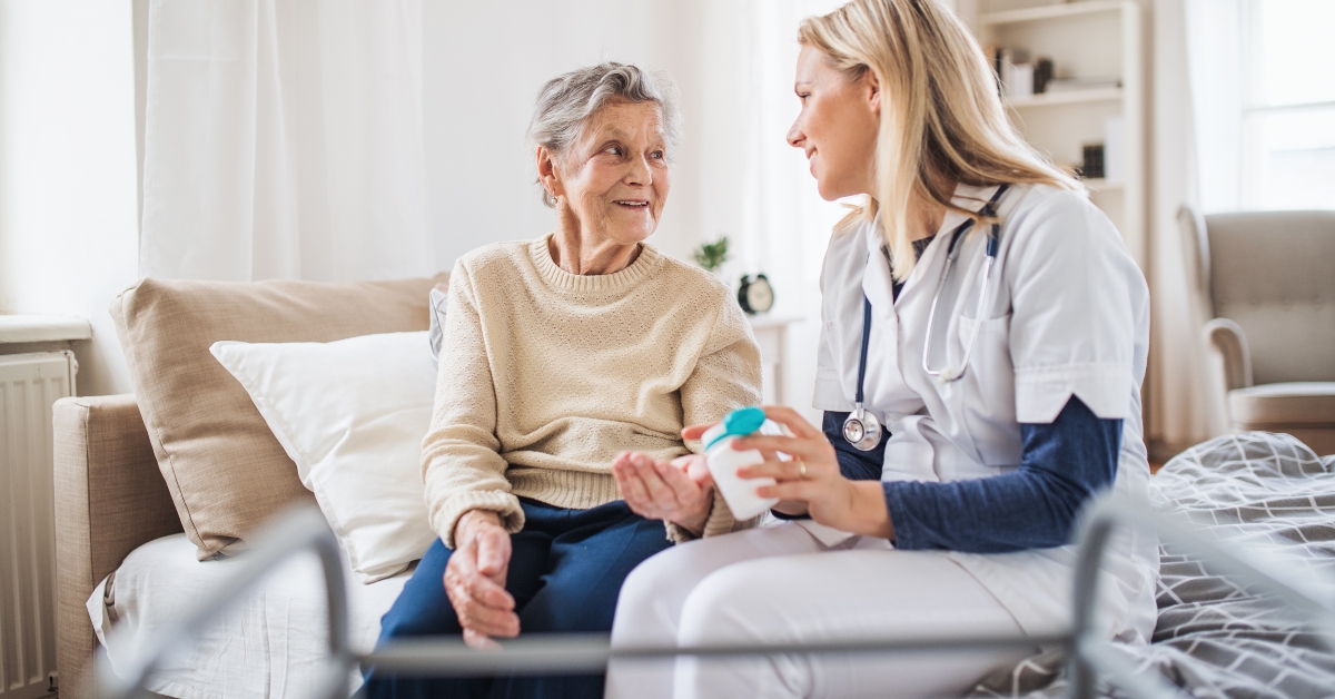 doctor explaining a senior woman how to take pills