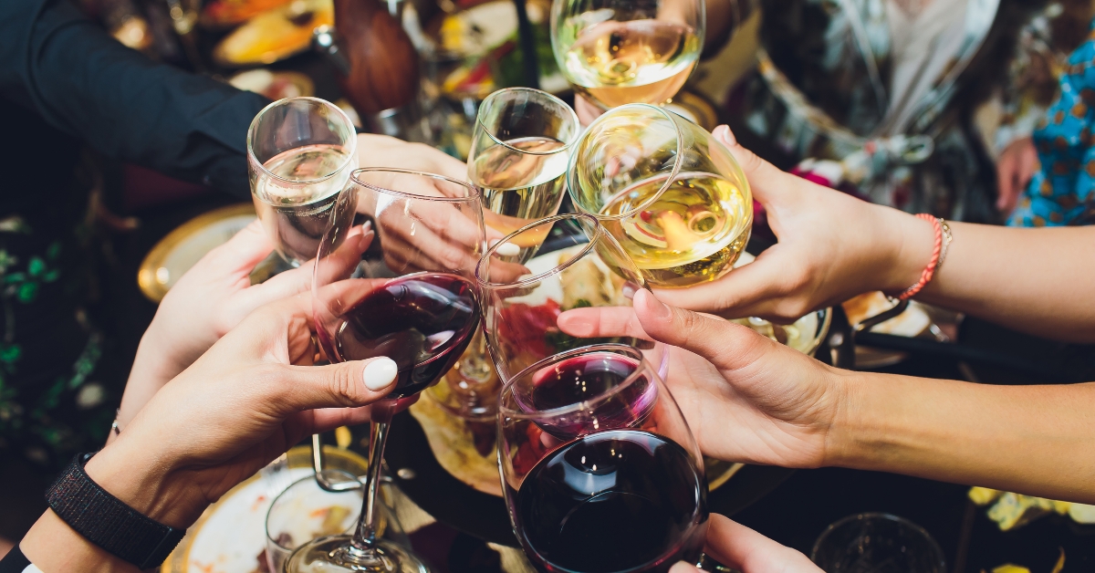 Champagne glasses in hands of people at party