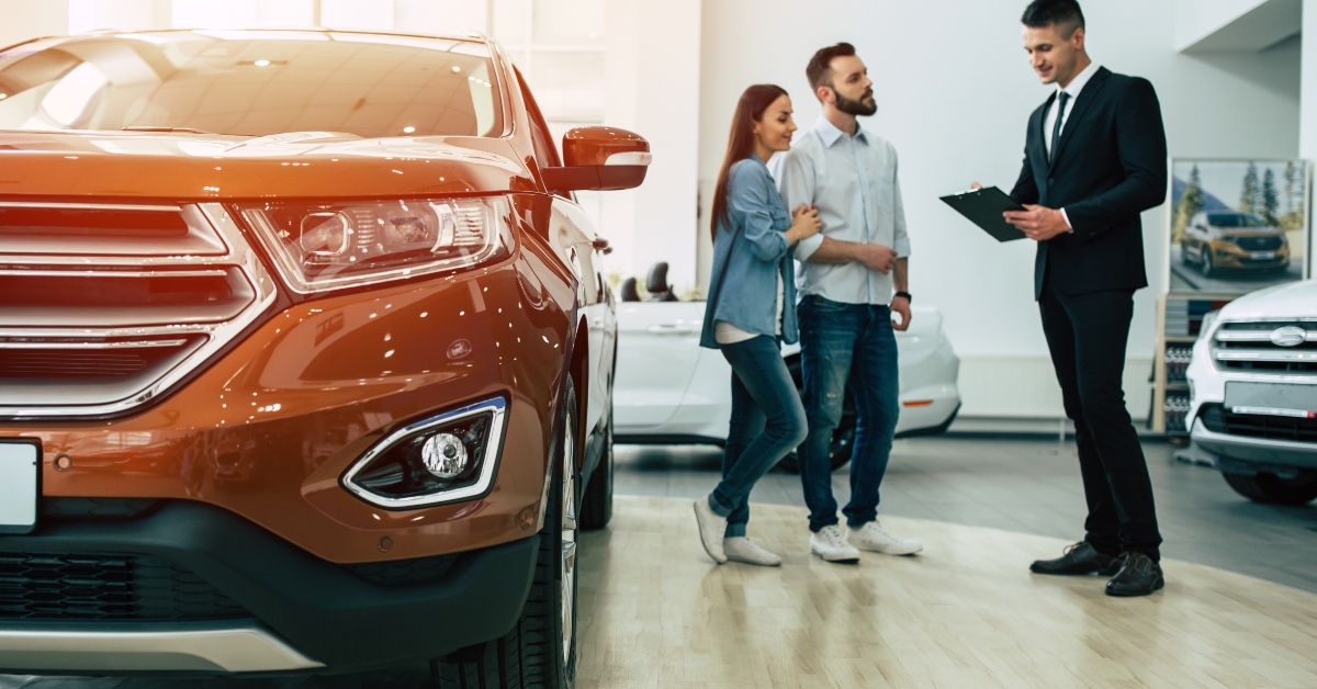 couple buying a new car