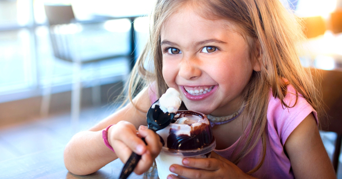 little girl eating sundae