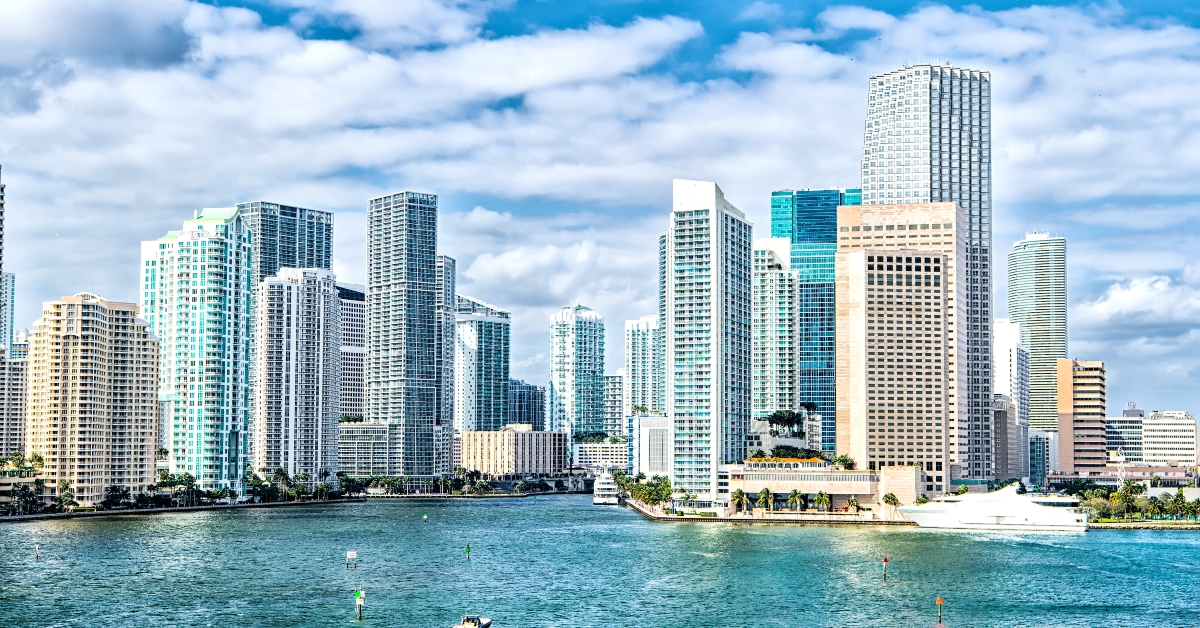 yachts sail on sea water to city