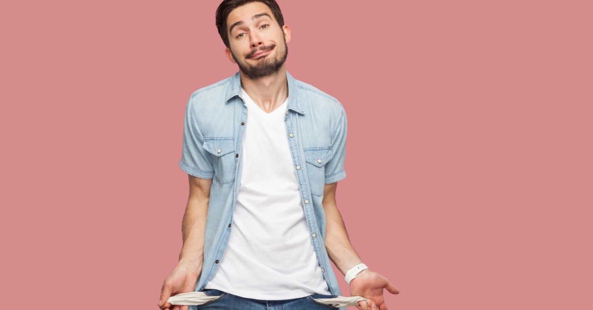 young man in casual dressing showing empty pockets