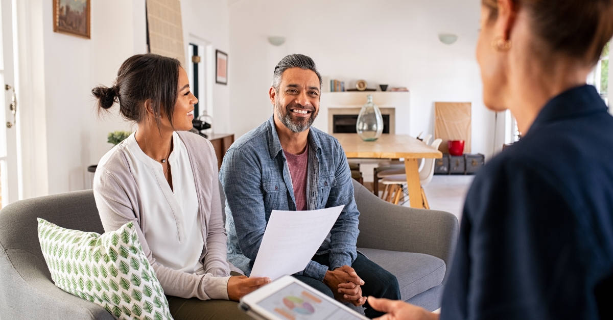 couple talking to financial advisor at home