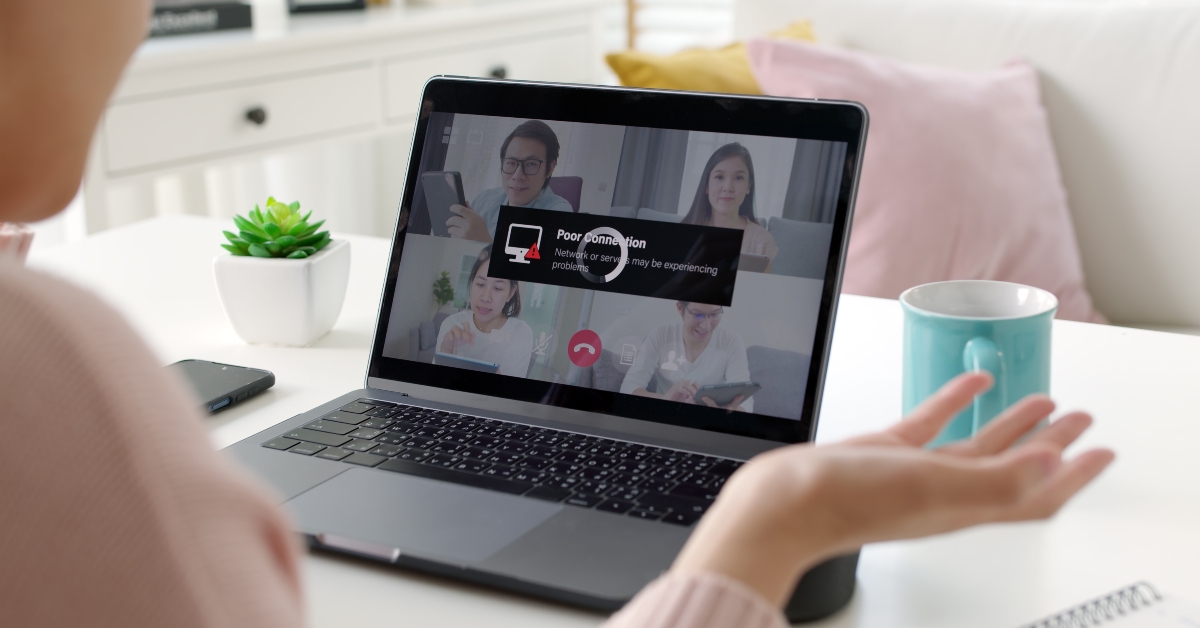 woman employee works from home using laptop with low internet connection