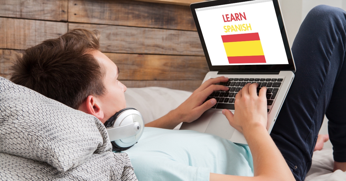 man learning spanish at home