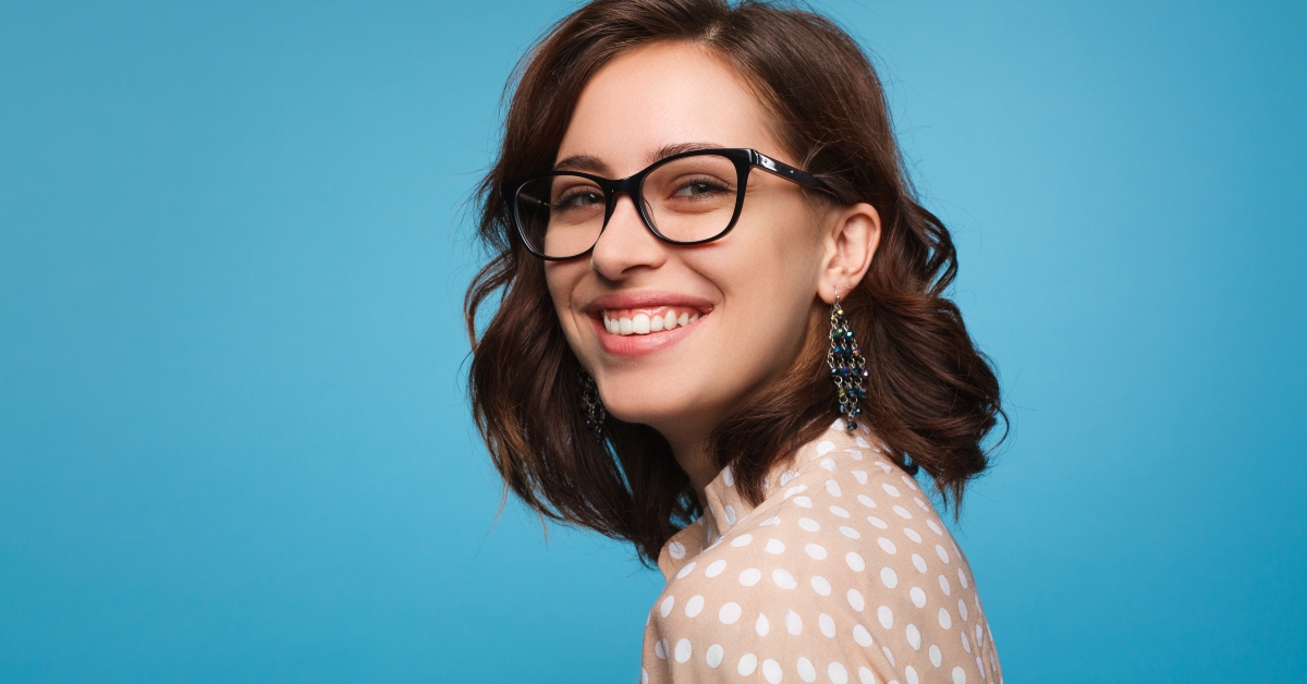 smiling woman posing in glasses