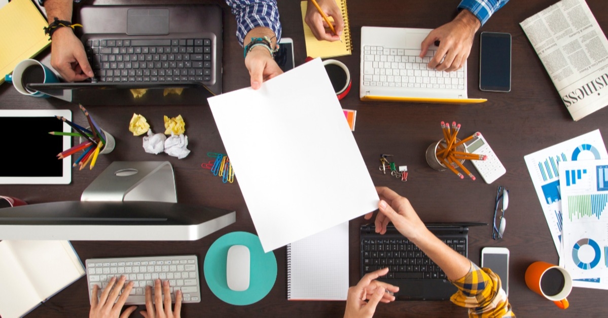 businesspeople working on an office desk