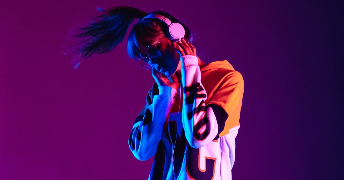 model wearing hoodie and headphones