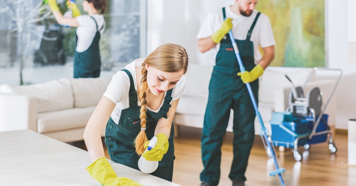 cleaning service employees with professional equipment