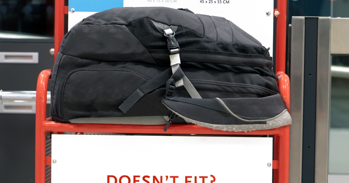large backpack lying on a control cage