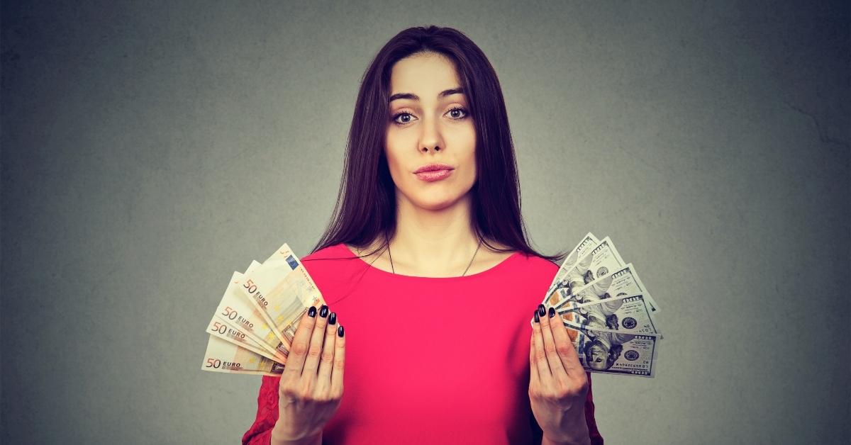 woman with euro and dollar currency banknotes
