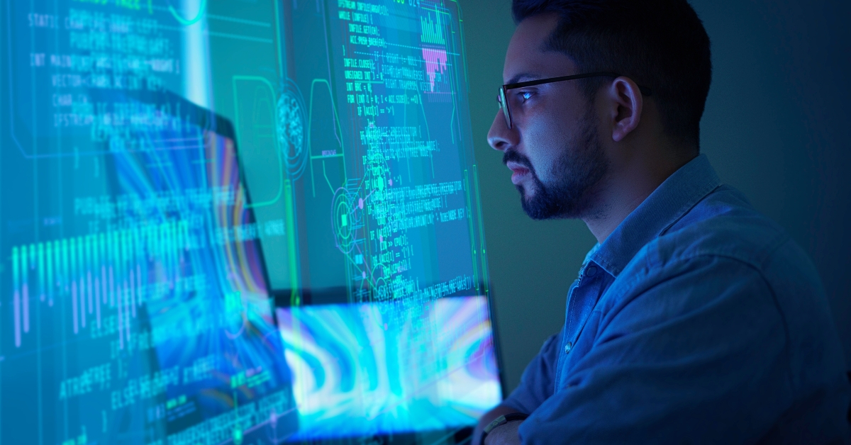 software developer working on his computer