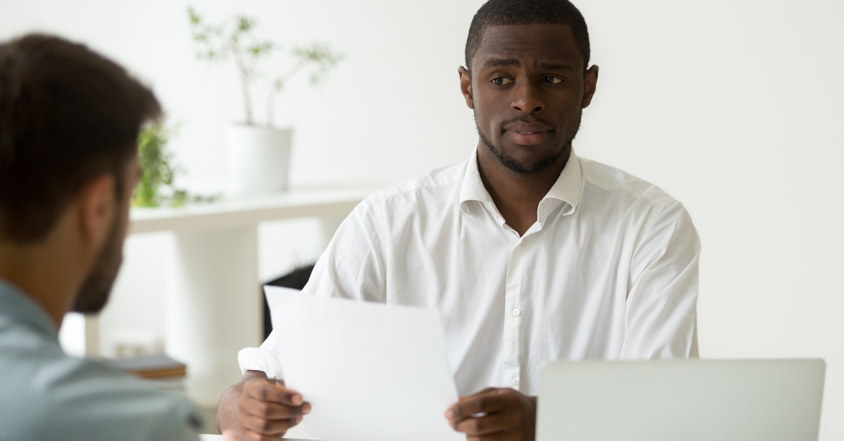 hr manager looking doubtful about hiring incompetent candidate