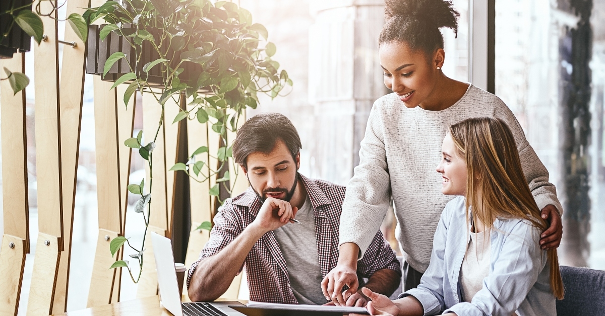 millennial colleagues discussing company financial statistics