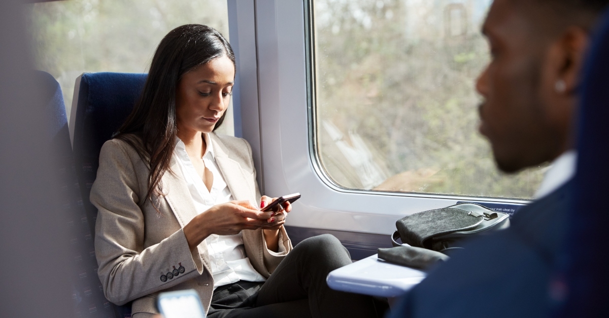 business passengers sitting in train commuting to work