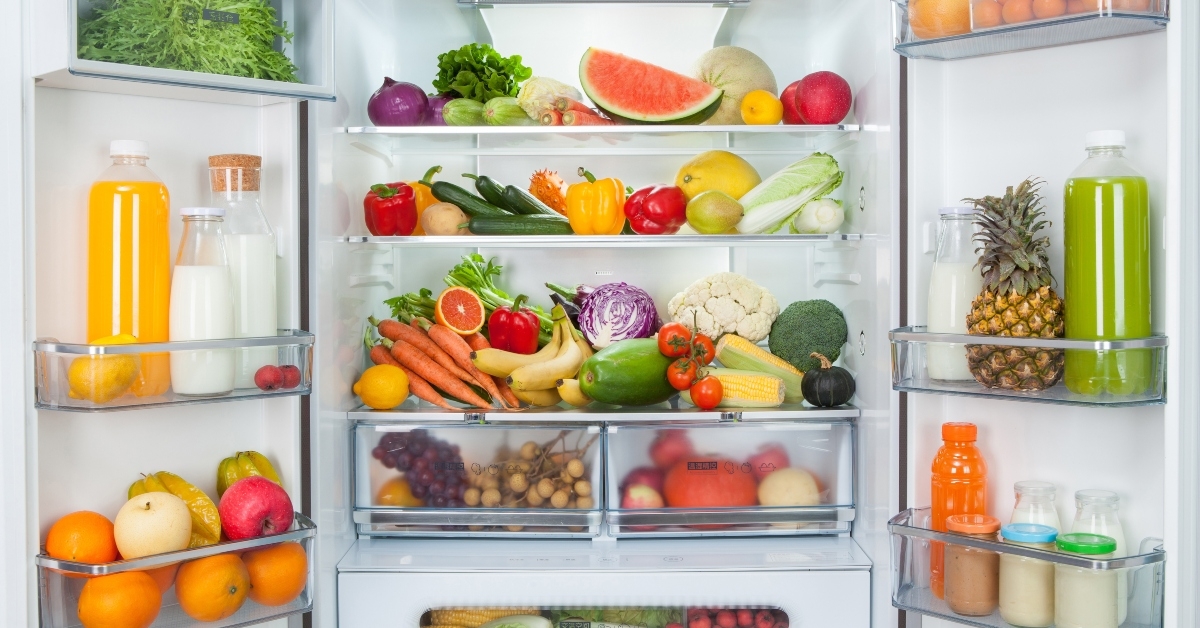 open fridge with fresh fruits and vegetables