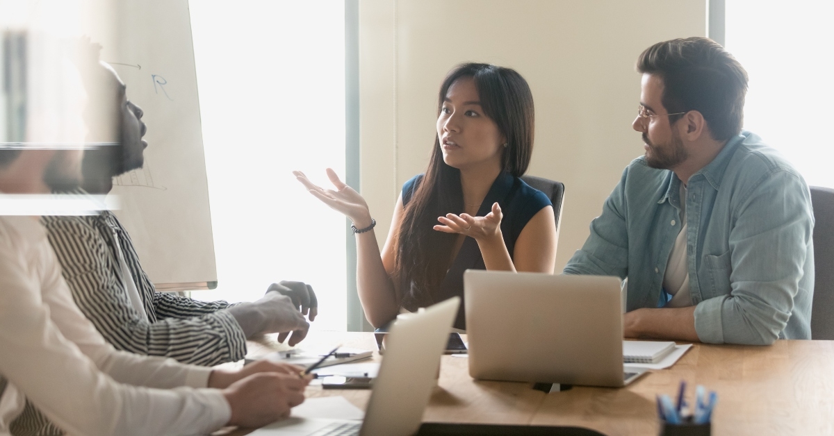 annoyed diverse employees arguing at briefing