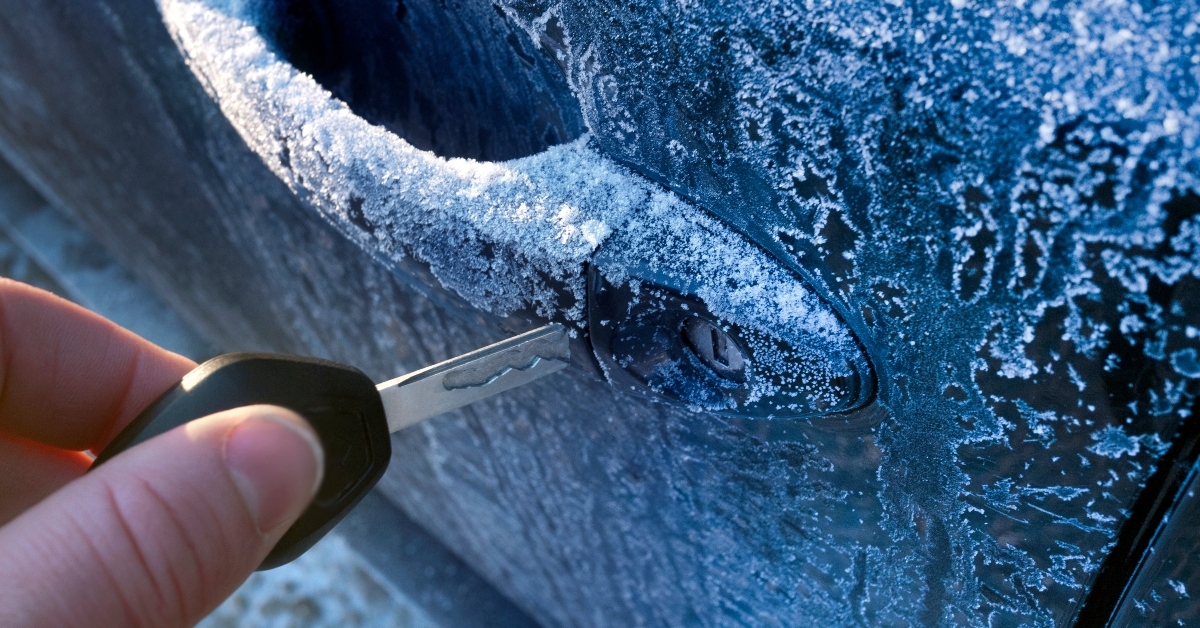 unlocking a car door on a cold frozen winter morning